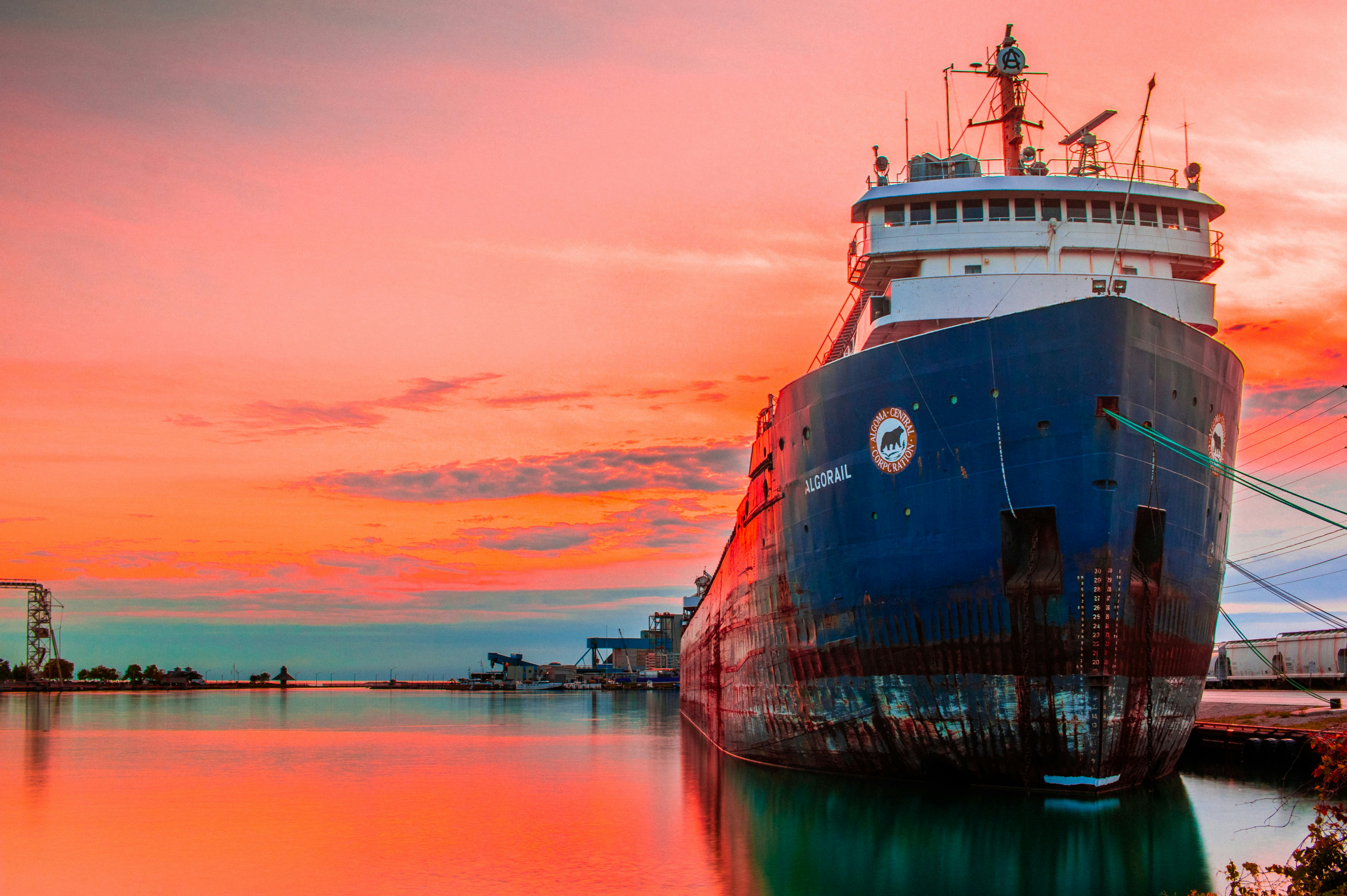 Tanker vessel at port during sunset